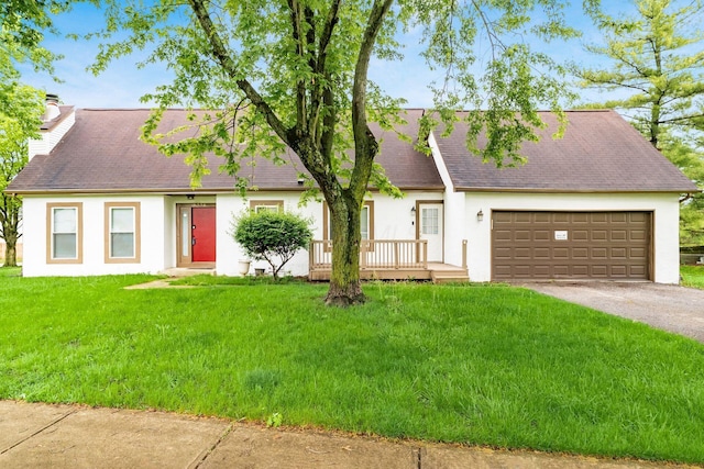 6556 Centennial Dr, Reynoldsburg, OH 43068 - view of front of house featuring a chimney, stucco siding, aphalt driveway, and an attached garage