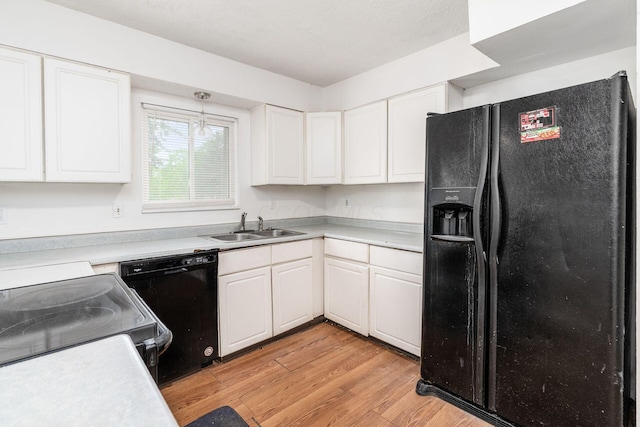 6556 Centennial Dr, Reynoldsburg, OH 43068 - kitchen featuring white cabinetry, black appliances, and a sink