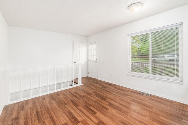 6556 Centennial Dr, Reynoldsburg, OH 43068 - unfurnished room featuring visible vents, wood finished floors, and baseboards