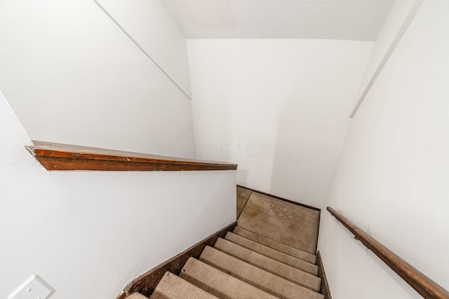 6556 Centennial Dr, Reynoldsburg, OH 43068 - stairs with a textured ceiling