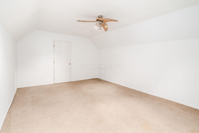 6556 Centennial Dr, Reynoldsburg, OH 43068 - additional living space with vaulted ceiling, light colored carpet, and a ceiling fan