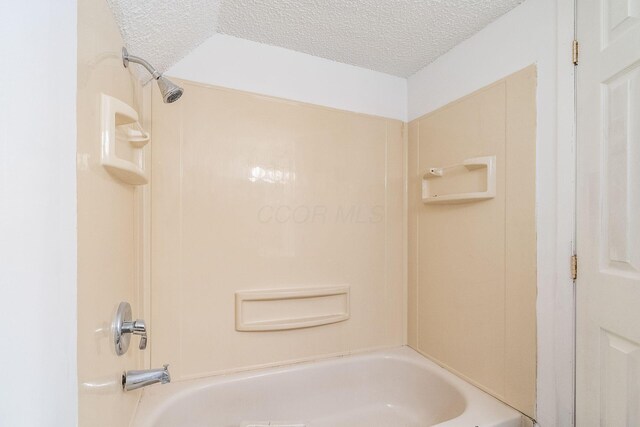 6556 Centennial Dr, Reynoldsburg, OH 43068 - bathroom featuring a textured ceiling and  shower combination