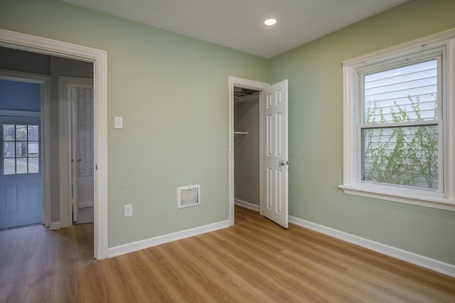 2513 Georgetown Ave, Toledo, OH 43613 - unfurnished bedroom featuring light wood-style floors, baseboards, recessed lighting, and visible vents