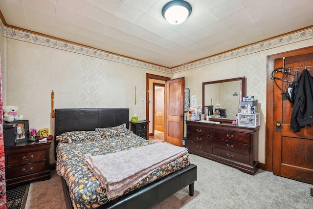 carpeted bedroom with crown molding