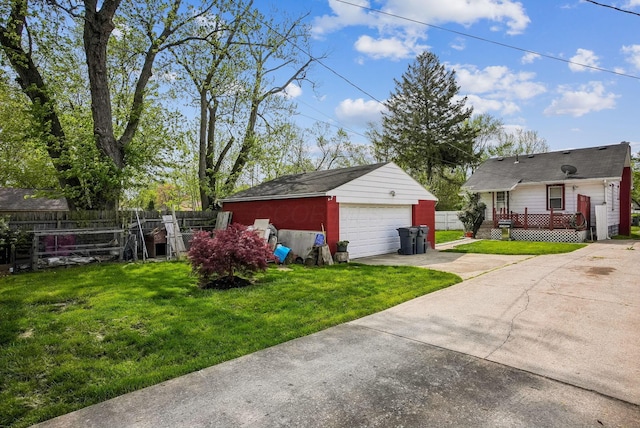 detached garage featuring fence