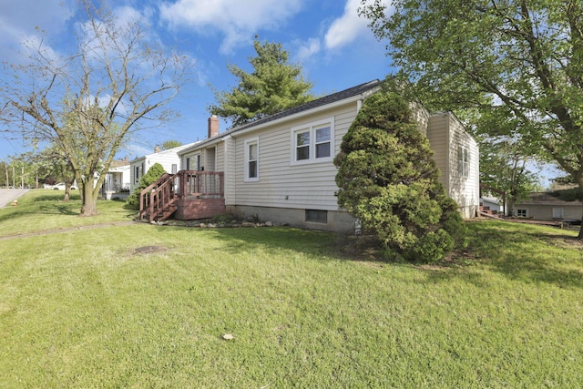 exterior space featuring a yard and a chimney