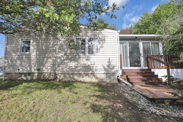 view of front of property with a sunroom and a front lawn
