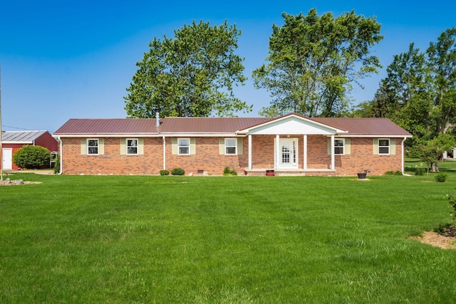 14140 State Route 56 SE, Mount Sterling, OH 43143 - view of front of home with a front yard, metal roof, and brick siding