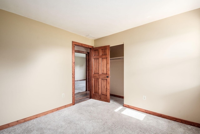 14140 State Route 56 SE, Mount Sterling, OH 43143 - unfurnished bedroom featuring light colored carpet, baseboards, and a closet