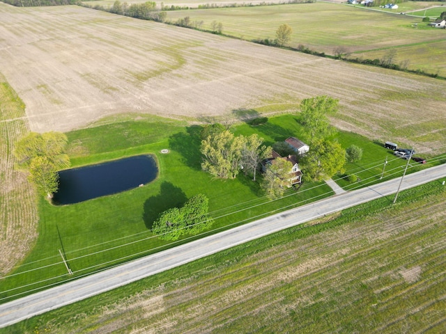 aerial view with a water view and a rural view