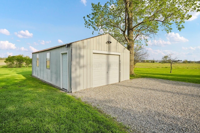 detached garage featuring driveway