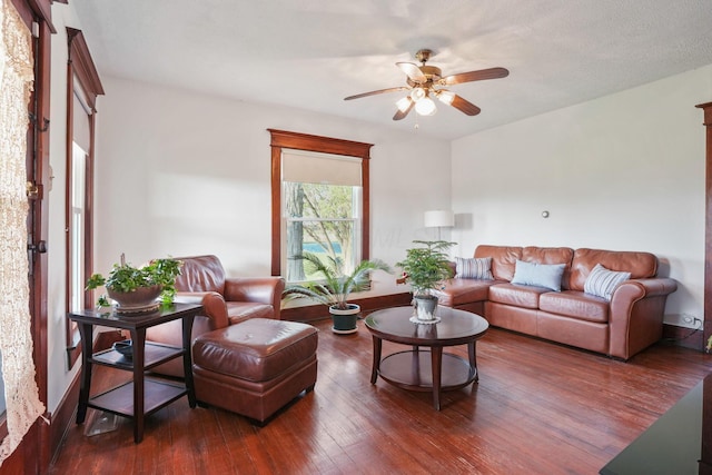 living area featuring wood-type flooring and ceiling fan