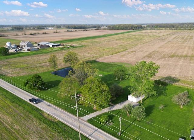 birds eye view of property with a rural view