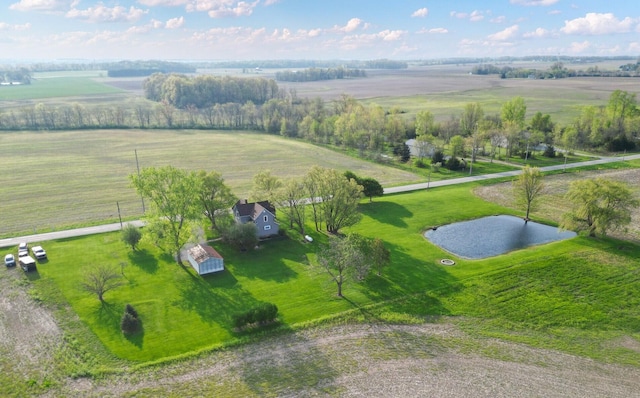 birds eye view of property featuring a water view and a rural view