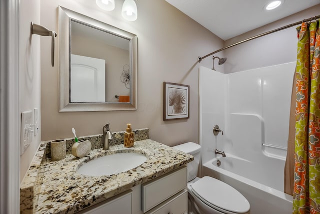 bathroom with vanity, recessed lighting, shower / bath combo with shower curtain, and toilet