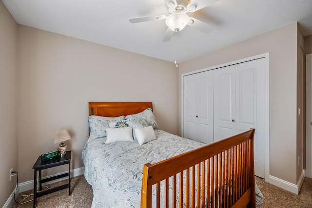 carpeted bedroom with a ceiling fan, baseboards, and a closet