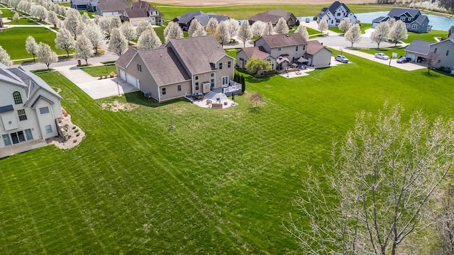 birds eye view of property with a residential view