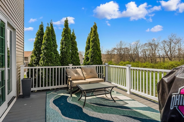 deck with an outdoor hangout area and central AC unit