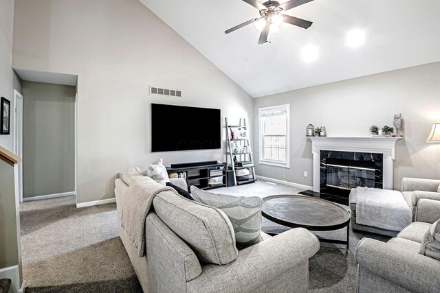 3622 Boathouse Dr, Hilliard, OH 43026 - carpeted living room with high vaulted ceiling, a ceiling fan, baseboards, a high end fireplace, and visible vents