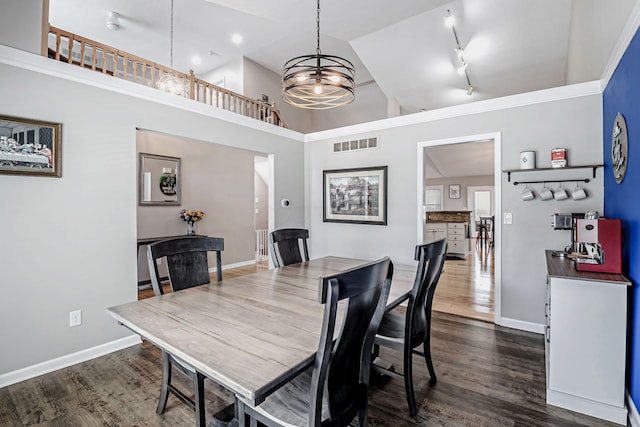 3622 Boathouse Dr, Hilliard, OH 43026 - dining room with baseboards, dark wood-type flooring, high vaulted ceiling, and visible vents