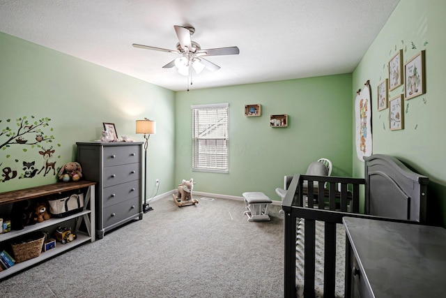 3622 Boathouse Dr, Hilliard, OH 43026 - carpeted bedroom with baseboards, a ceiling fan, and a crib