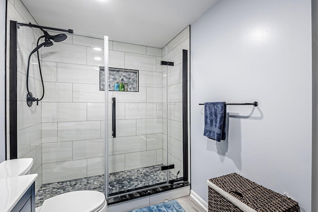 3622 Boathouse Dr, Hilliard, OH 43026 - full bath featuring a shower stall, wood finished floors, vanity, baseboards, and toilet