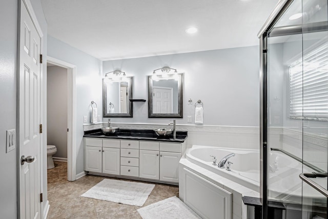 3622 Boathouse Dr, Hilliard, OH 43026 - full bath with double vanity, a bath, a sink, toilet, and recessed lighting