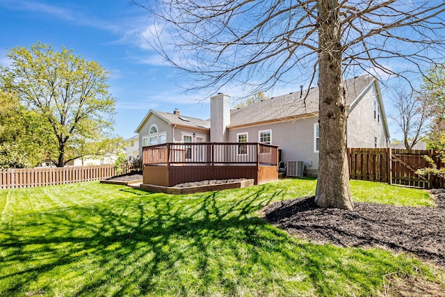3622 Boathouse Dr, Hilliard, OH 43026 - back of house featuring a chimney, a deck, central AC, a fenced backyard, and stucco siding