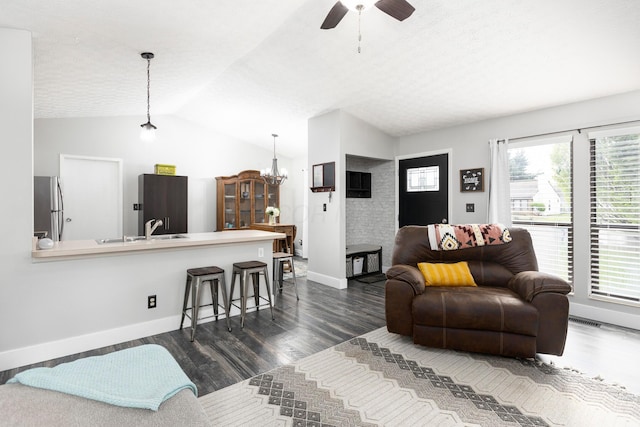 5756 Idana Ct, Westerville, OH 43081 - living room featuring vaulted ceiling, dark wood-type flooring, visible vents, and ceiling fan