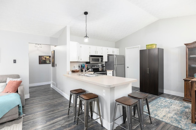 5756 Idana Ct, Westerville, OH 43081 - kitchen with a peninsula, stainless steel appliances, baseboards, and light countertops