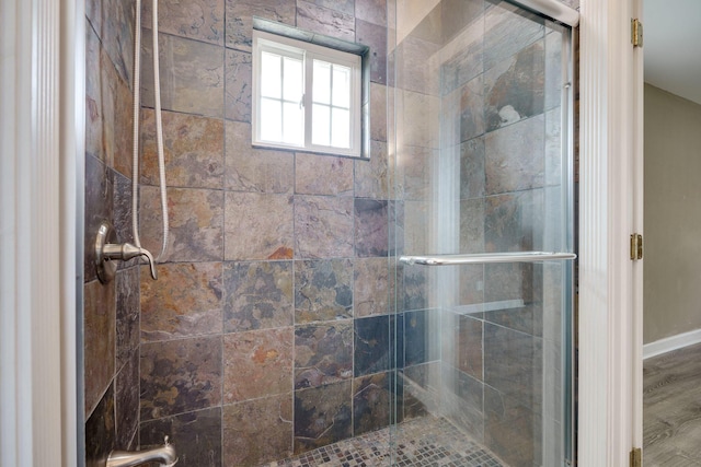 bathroom featuring a shower stall