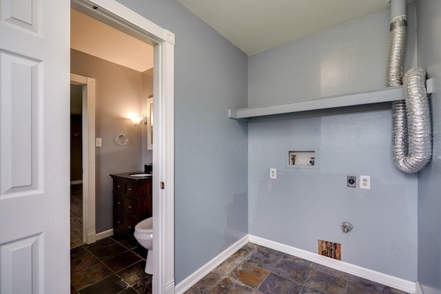clothes washing area featuring washer hookup, laundry area, electric dryer hookup, and stone tile flooring