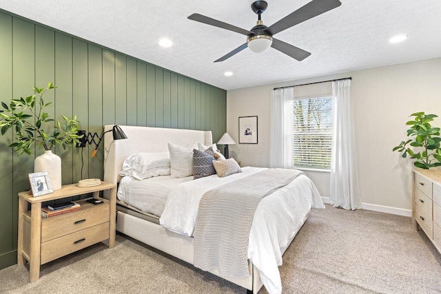 bedroom with ceiling fan, a textured ceiling, carpet, recessed lighting, and baseboards
