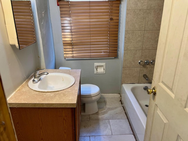 bathroom featuring vanity, baseboards, bathing tub / shower combination, and toilet