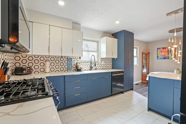 kitchen featuring marble finish floor, light countertops, a sink, dishwasher, and blue cabinetry