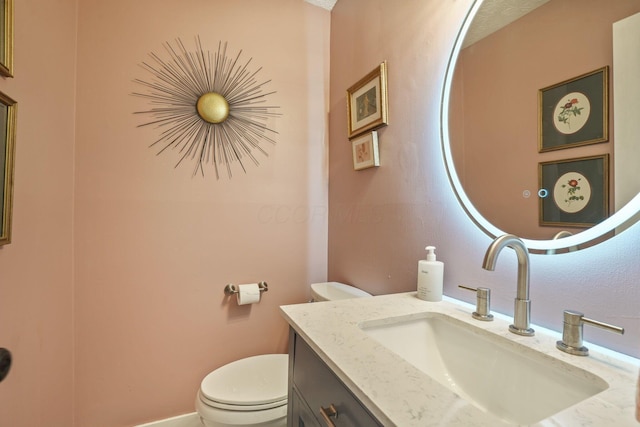 half bath with toilet and vanity