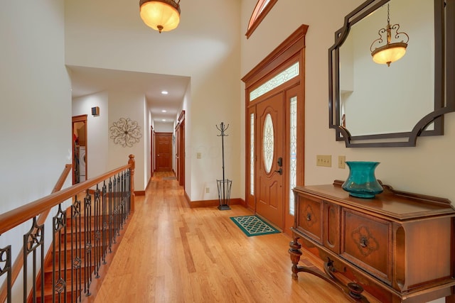 2051 River Rd, Delaware, OH 43015 - foyer featuring light wood-type flooring, baseboards, a towering ceiling, and recessed lighting