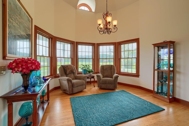 2051 River Rd, Delaware, OH 43015 - sitting room with a chandelier, wood finished floors, baseboards, and a high ceiling