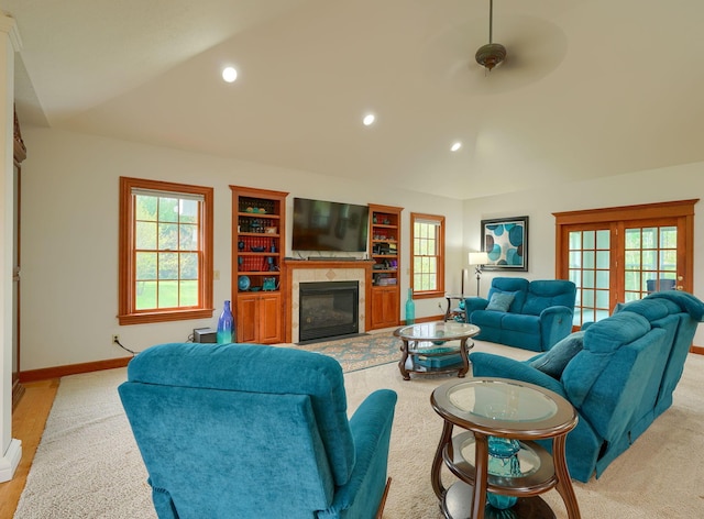 2051 River Rd, Delaware, OH 43015 - living area featuring a glass covered fireplace, baseboards, recessed lighting, and lofted ceiling