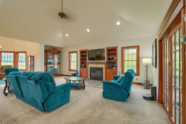2051 River Rd, Delaware, OH 43015 - living area with vaulted ceiling, carpet, a glass covered fireplace, baseboards, and recessed lighting