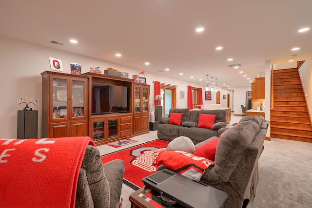 2051 River Rd, Delaware, OH 43015 - living area with light carpet, stairs, and recessed lighting