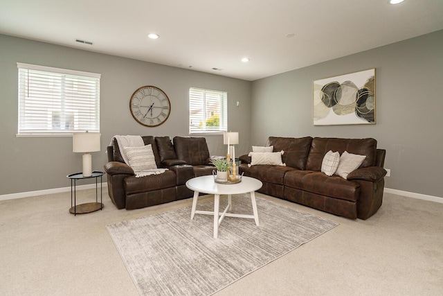 carpeted living room featuring baseboards, recessed lighting, and visible vents