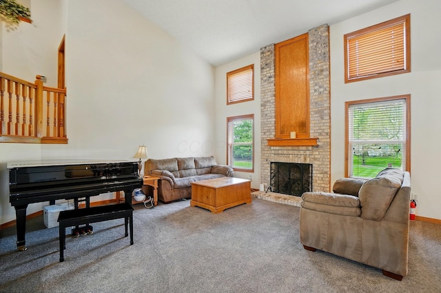 1775 Harrison Pond Dr, New Albany, OH 43054 - carpeted living room with high vaulted ceiling, healthy amount of natural light, and a fireplace