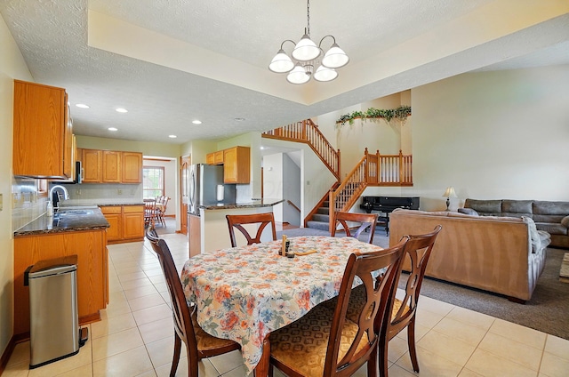 1775 Harrison Pond Dr, New Albany, OH 43054 - dining space featuring light tile patterned flooring, a chandelier, stairway, recessed lighting, and a textured ceiling