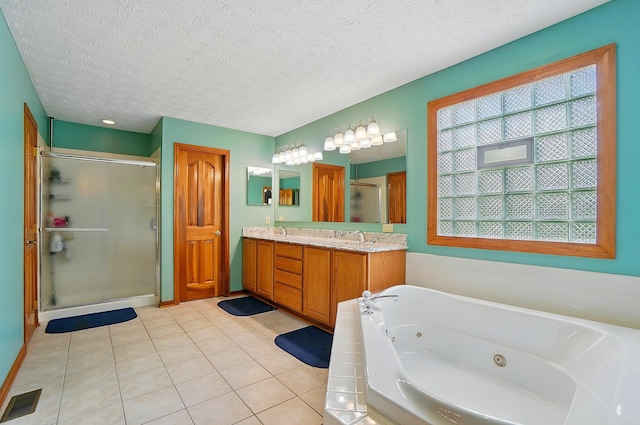 1775 Harrison Pond Dr, New Albany, OH 43054 - full bath featuring a whirlpool tub, a stall shower, double vanity, tile patterned floors, and a textured ceiling