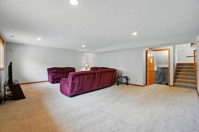 1775 Harrison Pond Dr, New Albany, OH 43054 - carpeted living area with baseboards, stairs, recessed lighting, and a textured ceiling