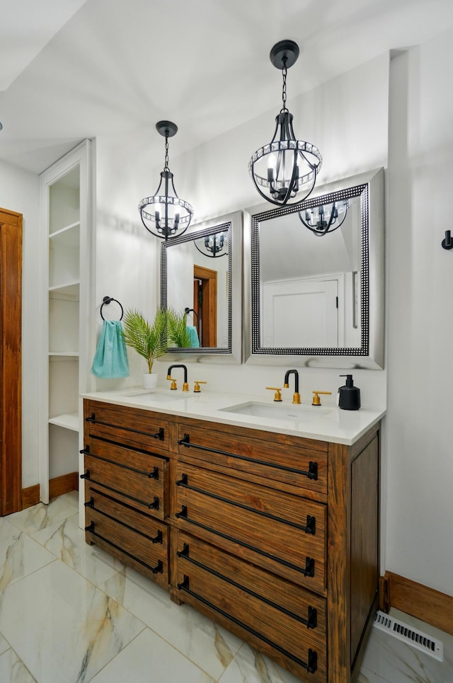 bathroom with visible vents, marble finish floor, and a chandelier