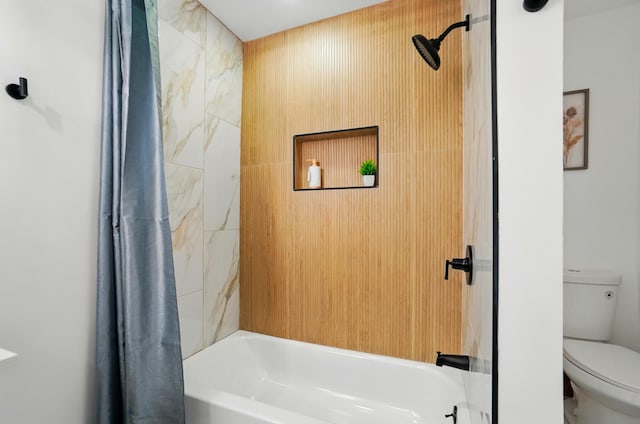 bathroom featuring shower / bath combo and toilet