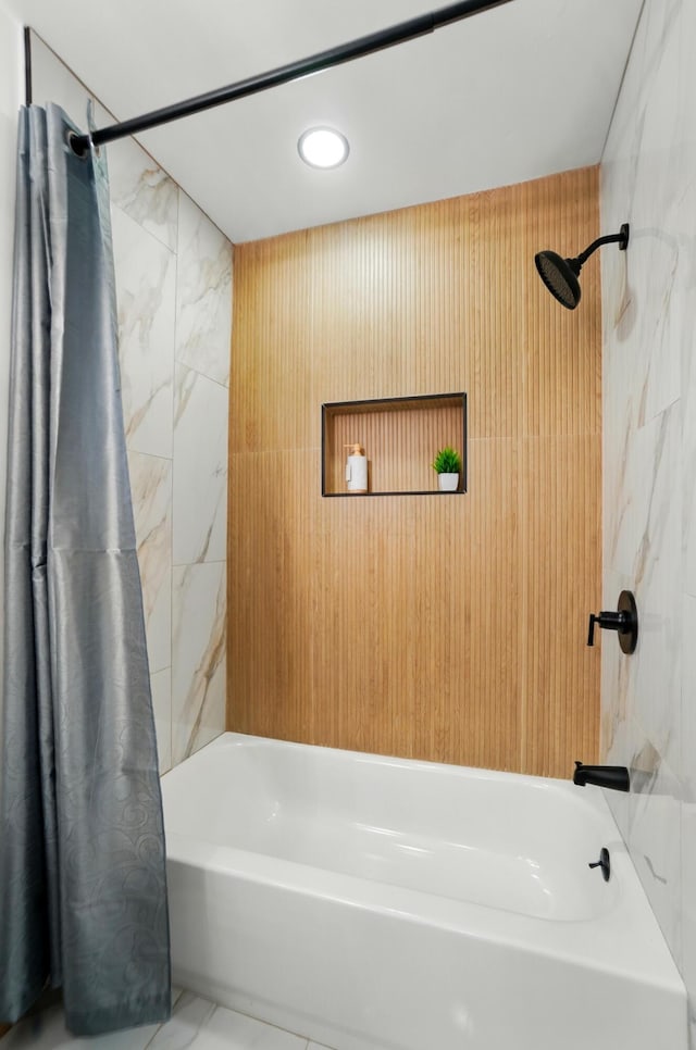 bathroom with shower / bath combo and recessed lighting