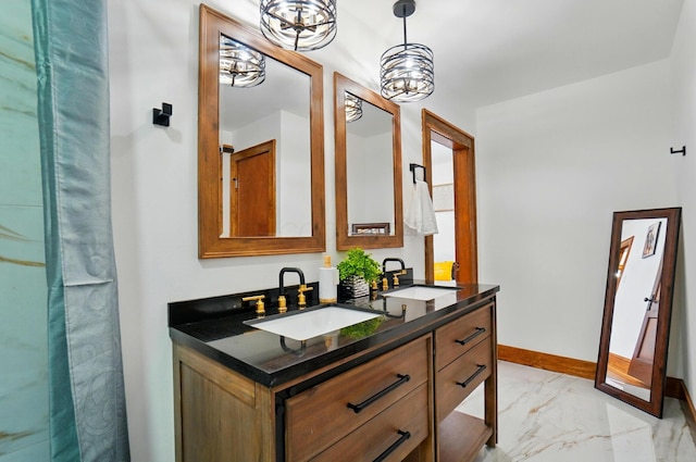 full bath with double vanity, baseboards, a sink, and marble finish floor
